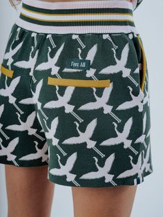 Introducing the "Flora Short" – a fresh twist on our beloved "Govvy Short" infused with the playful charm of our new mascot, Flora the flamingo. Designed for comfort and style on and off the golf course, the Flora Short boasts the same beloved silhouette as its predecessor, now adorned with Flora's delightful pattern all over. Crafted from cozy and luxurious knit fabric, these shorts envelop you in softness while ensuring unrestricted movement throughout your game. Slip your essentials into the Flamingo Pattern, Bow Bag, Short A, Golf Apparel, Knit Shorts, Knit Fashion, Golf Outfit, Luxury Fabrics, Golf Course