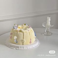 a white cake sitting on top of a table