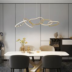 an elegant dining room with modern lighting fixtures and marble table in front of white walls