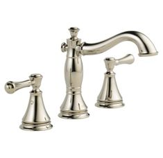 a chrome faucet with two handles