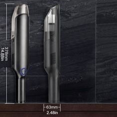 an electric toothbrush is shown next to a black marble wall and the measurements for it