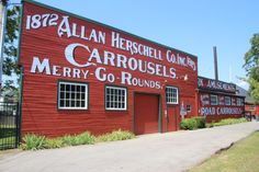 an old red building with the words carrousels merry go rounds painted on it