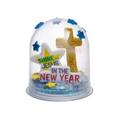 a snow globe with the words shine for jesus in the new year