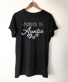 This Promoted To Auntie T-Shirt is an awesome gift idea for your aunt, sister, or sister-in-law. Great way to reveal your pregnancy, say thanks from a niece or nephew or just showcase how cool your auntie is! This shirt is available on Etsy and Stag and Peach site. #auntie #aunt #auntgift #auntieshirt #sisterbabyreveal #babyrevealtosister #giftfromkids #giftfromniece #giftfromnephew  #GiftForAuntie #pregnancyannouncement Promoted To Auntie, Chihuahua Shirt, Avocado Shirt, Brunch Shirts, Avocado T Shirt, Aunt Shirt, Auntie Shirts, New Aunt, Aunt Shirts