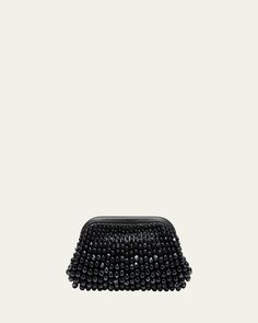 Cult Gaia "Nia" clutch bag in beaded acrylic and leather     Structured top with hinge closure     Lining: Polyester/polyurethane    Approx. 6.5"H x 12.5"W x 3"D    Imported Beaded Top Handle Evening Bag, Chic Beaded Handheld Clutch, Evening Clutch With Pearl Handle, Evening Handheld Beaded Clutch, Formal Handheld Beaded Clutch, Handheld Beaded Clutch, Formal Beaded Handheld Clutch, Beaded Handheld Clutch For Events, Evening Beaded Clutch