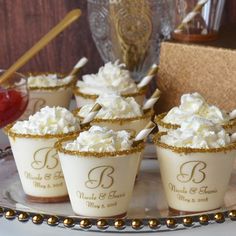 cupcakes with white frosting and gold trim on a plate