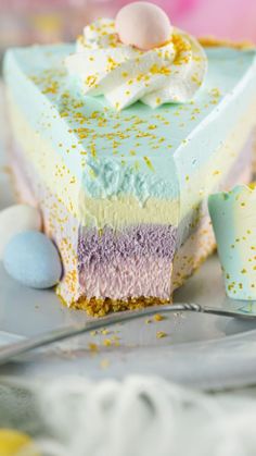 a slice of cake with pastel colors and gold sprinkles