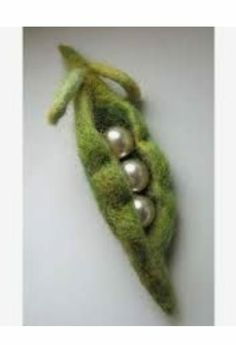 a pea pod with three peas in it