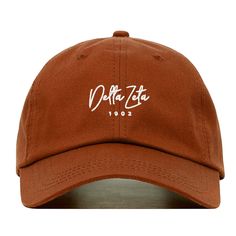 This delta zeta baseball hat is made for you. Customize your dad cap by choosing from a variety of colors. It's fully adjustable and easy to style! We are an official greek licensed vendor. H O W T O O R D E R --------------------------- * Use the first drop-down menu to select your hat color * Use the second drop-down menu to select your thread color NOTE: This is referring to the embroidered design on the hat, not the stitching of the hat itself. If you have a request for a design or want a di Streetwear Caps, Little Sister Gifts, Pink Cap, Heavy Metal Rock, Rose Beige, Embroidered Baseball, Dad Cap, White Caps, Embroidered Baseball Caps