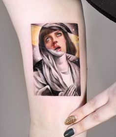 a woman with a surprised look on her face is shown in this artistic tattoo design