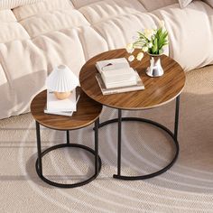 two wooden tables sitting next to each other on top of a carpeted living room floor