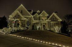 a house covered in christmas lights and decorations