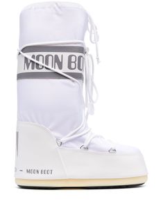 White Sporty Sneakers With Front Lace-up, White Sporty Lace-up Sneakers, White Waterproof Lace-up Sneakers, White Winter Boots With Rubber Sole, White Lace-up Boots With Rubber Sole, Casual High-top Snow Boots, White Winter Boots For Streetwear, White Boots For Winter Streetwear, White Sporty High-top Boots