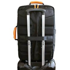 a black suitcase with two orange handles and handlebars on it's wheels