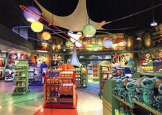 the inside of a toy store filled with lots of toys