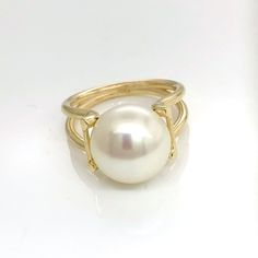 Impressive 9 carat yellow gold ring set with freshwater button pearl. Pearl is 12 mm in diameter, exceptionally  high lustre . Split shank Ring size is N (US Size 6 3/4) Ring weight is 5.7 grams Formal Yellow Gold Pearl Ring With High Luster, Formal High Luster Yellow Gold Pearl Ring, Elegant Gold Pearl Ring With High Luster, Formal White Pearl Ring With High Luster, Timeless White Pearl Ring, Elegant High Luster Gold Pearl Ring, Classic Formal Pearl Open Ring, Classic Formal Open Pearl Ring, Classic Round Pearl Ring With Pearl Drop