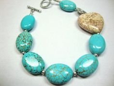 "This special piece has turquoise magnesite with small silver beads separating each piece. Off center is a white turquoise heart (sometimes called Buffalo Stone) and a delicate silver flat bead. To finish the theme and to close the bracelet is an ornate toggle clasp. This bracelet is 8\" in length, but I can make you a different size if desired. Just let me know in the Notes to Seller upon checkout. Special gift for a special person!" Bohemian Turquoise Bracelets With Heart Beads, Bohemian Turquoise Bracelet With Heart Beads, Turquoise Heart-shaped Beaded Bracelet, Turquoise Bracelets With Heart Beads For Jewelry Making, Turquoise Heart-shaped Gemstone Bead Jewelry, Turquoise Beaded Bracelets With Heart Beads, Turquoise Heart Beads Bracelet, Turquoise Heart, Silver Flats