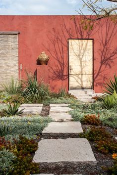 a red building with a stone path leading to it