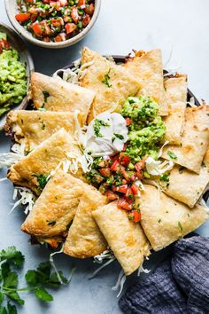 tortillas with guacamole and salsa on the side