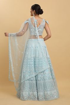 Pastel blue attached can-can lehenga featuring thread sequin and bead embroidery in floral motif. Paired with a co-ordinating tassel detailed, padded blouse and an embroidered sheer dupatta. - Aza Fashions Light Blue Semi-stitched Lehenga With Resham Embroidery, Light Blue Anarkali Dupatta For Reception, Light Blue Zari Work Anarkali Set For Reception, Blue Net Anarkali Dupatta, Blue Anarkali Net Dupatta, Blue Anarkali Style Net Dupatta, Blue Net Dupatta With Resham Embroidery, Blue Resham Embroidered Net Dupatta, Blue Embellished Dupatta For Reception