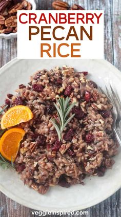 cranberry pecan rice on a white plate with orange slices