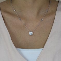 Metal: 925 Sterling Silver Center Stone: Cushion Cut Halo Stone: Brilliant Pavé Set Center Stone Weight: 2.40 ct, 8.0mm Total Stone Weight: 3.64 cttw Chain Length: 16 in, 17 in, 18 in Chain Width: 1.0mm Pendant Dimension: 11.0mm (L) x 11.0mm (W) Stationary Dimension: 4.0mm (L) x 4.0mm (W) Stone Setting: 4-Prong Basket Clasp: Lobster Claw Cushion Cut Halo, Diamond Pendants Designs, Everyday Jewellery, Halo Necklace, Diamond Simulant, Cushion Cut Diamonds, Stone Setting, Wedding Jewellery Necklace, Pendant Design