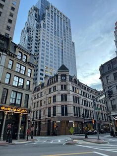 an intersection in the city with tall buildings