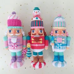 three crocheted nutcrackers standing next to each other