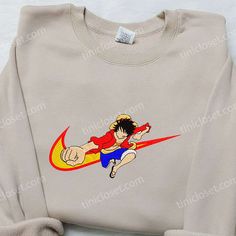 One Piece Luffy x Nike Swoosh Shirt, One Piece Embroidered Sweatshirt, Anime x Nike Embroidered Hoodie Sporty Cotton Sweatshirt With Character Print, Sporty Hoodie With Cartoon Print And Crew Neck, Sporty Crew Neck Hoodie With Cartoon Print, Sporty Cotton Sweatshirt With Cartoon Print, Anime X Nike, One Piece Embroidery, Shirt Video, Embroidered Apparel, Bespoke Shirts