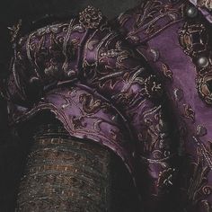 a close up view of an ornate purple shirt