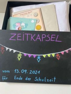 a chalkboard with the words zeitkapsel written on it in german