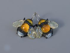 Dangle Bee earrings are made from dichroic glass and have silver hooks. Glass lampwork Bee jewelry is a great gift idea for birthsday Details size 3 cm (1.18 inch) weight 5-6 gramm Here you can find bee necklace for this earrings https://www.etsy.com/listing/836501932/bee-necklace-glass-pendant-best-friend?ref=shop_home_active_17&crt=1 ATTENTION You are bying an absolutely handmade product, so the product you receive can have some insignificant differences from the photo Don't drop! Glass can be Glass Jewelry With Lever Back Ear Wires For Gift, Handmade Murano Glass Earrings As Gift, Handmade Murano Glass Earrings For Gift, Bee Fashion, Bee Jewelry Necklaces, Real Bug Jewelry, Sparkily Bee Jewelry, Bee Charm Jewelry, Unique Dangle Earrings