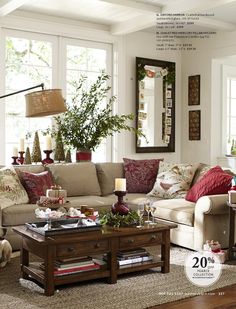 a living room filled with furniture and a dog sitting in front of the coffee table