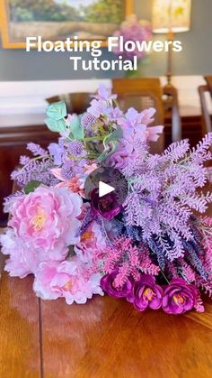 the flowers are sitting on the table in front of the camera and text that reads floating flowers