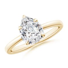 a cushion cut diamond engagement ring in yellow gold