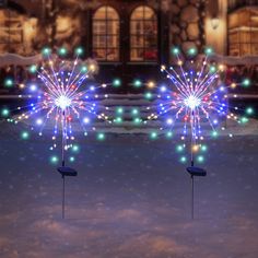 two fireworks are lit up in the snow