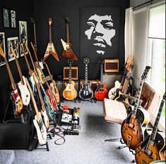 a room filled with guitars and other musical instruments