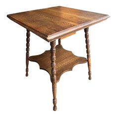 an old wooden table with two legs and a square top, on a white background