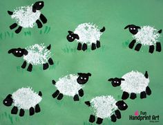 a group of black and white sheep painted on green paper with grass in the background