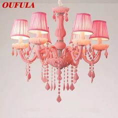 a pink chandelier with five lamps hanging from it's sides and the words oufula written below