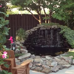 a small pond in the middle of a garden