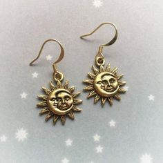 Looking for a jewelry but can’t decide whether you’re a sun or a moon child? Worry not! The Sun and Moon Hook earrings highlighting top-grade sculpted suns and moons will certainly suit your taste! Grab a pair!Metals Type: Zinc AlloyAvailable in Gold and Silver Guaranteed safe check out: PAYPAL | VISA | MASTERCARD Please allow 9 - 24 business days for the item to arrive. Sun Moon Earrings, Hampi, Summer 22, Trendy Ring, Retro Jewelry, Party Earrings, Wedding Band Sets, Mode Inspo, Moon Earrings