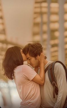 a man and woman standing next to each other