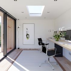 a room with a desk, chair, and large window in the middle of it