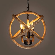 an image of a chandelier that is hanging from the ceiling and has rope wrapped around it