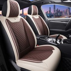 the interior of a car with brown and white stitching on it's seat covers