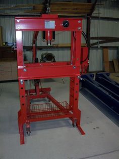 a red work bench in a garage