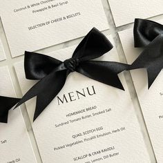 the menu cards have black bows on them