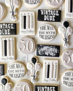 decorated cookies are arranged in the shape of letters and numbers for 50th birthday party favors