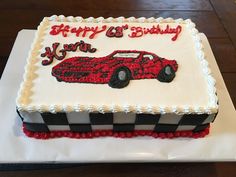 a birthday cake with a red car on it